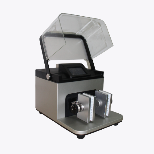 Laboratory sample-preparation machine with an open safety cover and adjustable grinding plates.